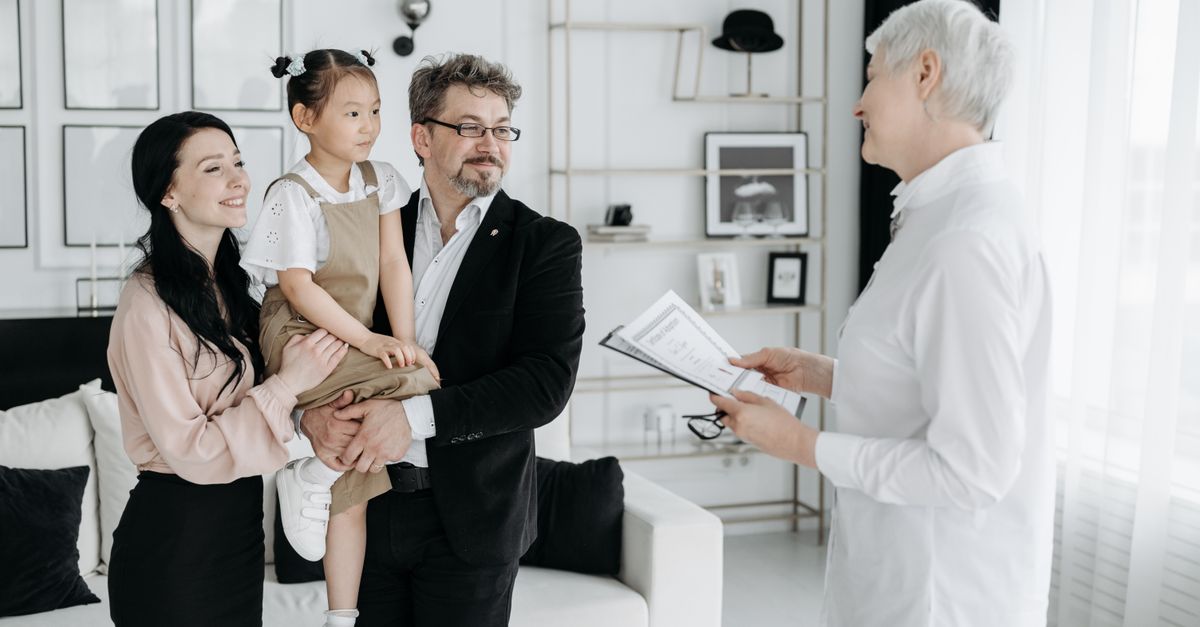 Family signing documents